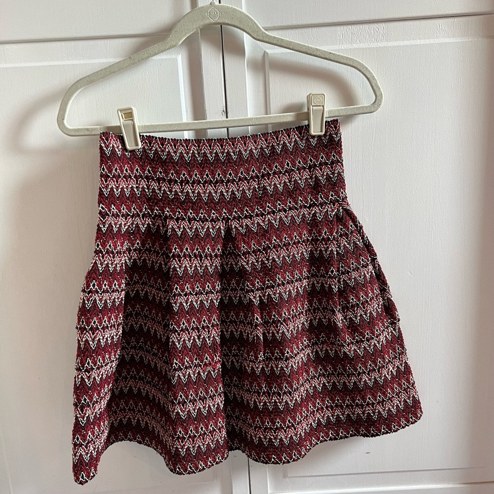 Red/ white/ black patterned peplum skirt. Great for the holiday season!